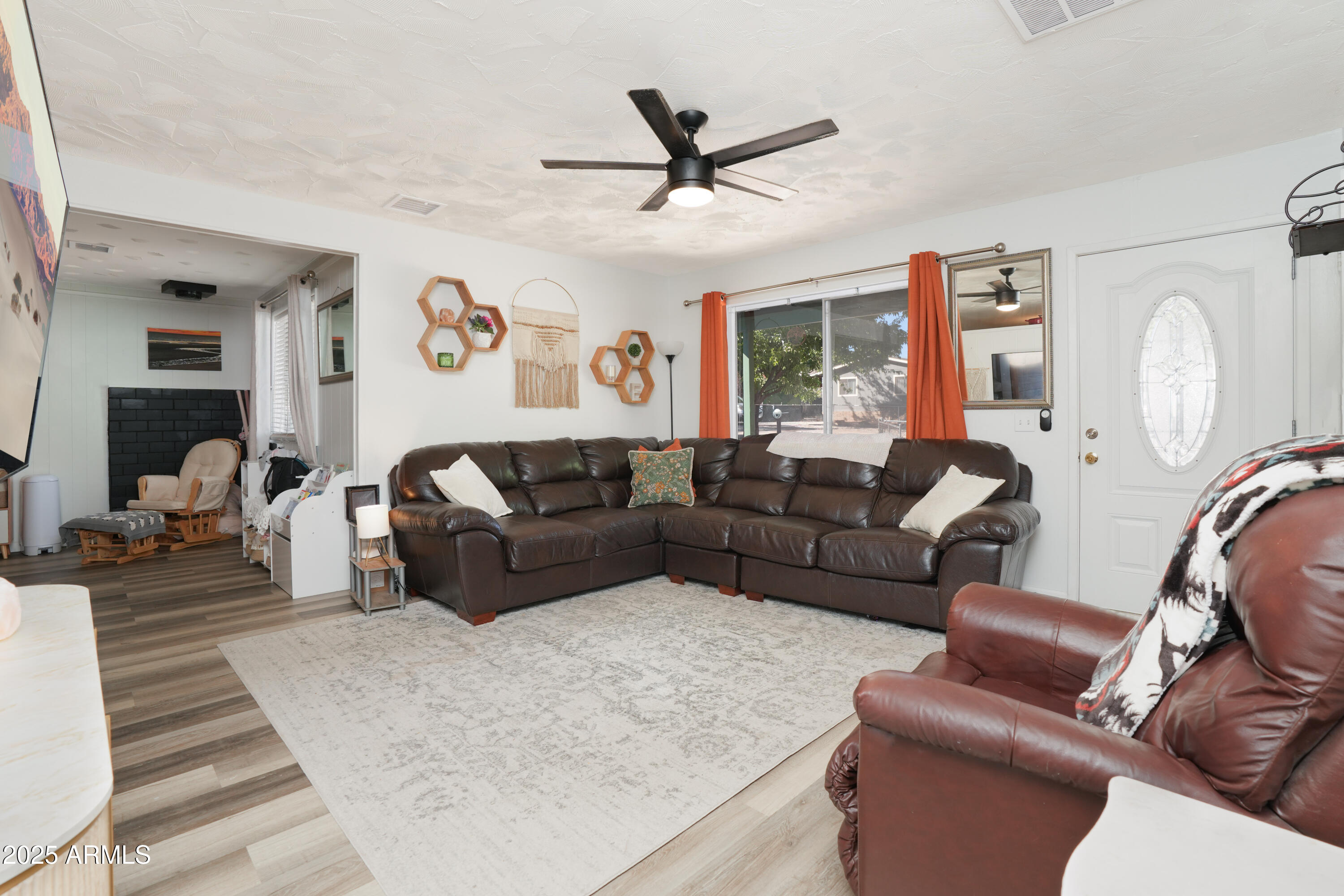 605 3rd N Street Clarkdale, AZ 86324 - Photo 6 of 37 a living room with furniture a clock and a large window