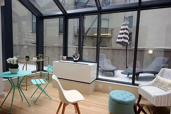 a work place that has a rug and a chair