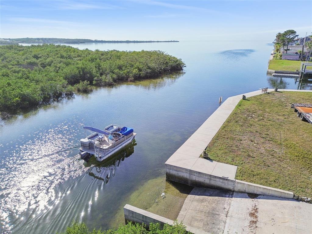 6374 Boatyard Drive Hudson, FL 34667 - Photo 25 of 25 a view of a lake with outdoor seating
