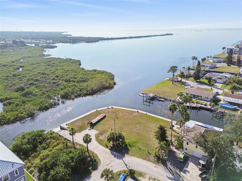 6374 Boatyard Drive Hudson, FL 34667 - Photo 9 of 25 an aerial view of a house with a lake view