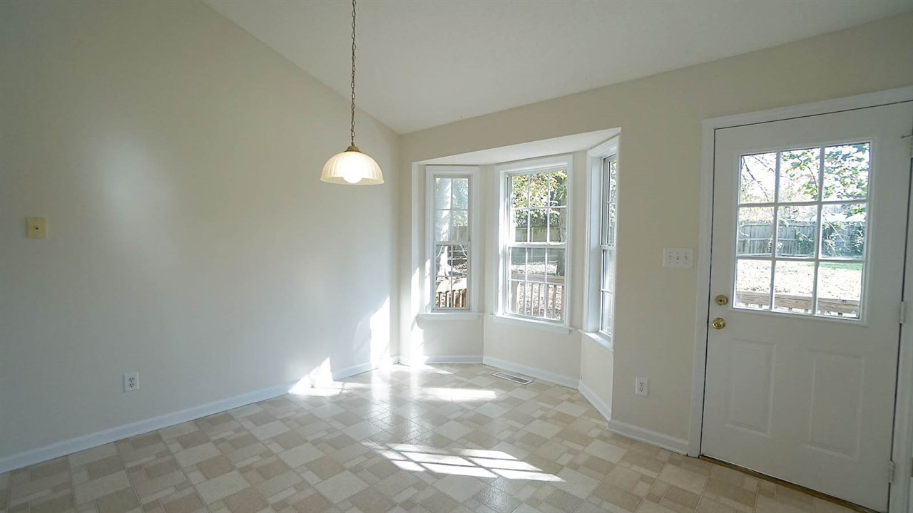 701 Kavkaz Street Raleigh, NC 27610 - Photo 11 of 25 Cheery Breakfast Area Overlooks Large Fenced Yard