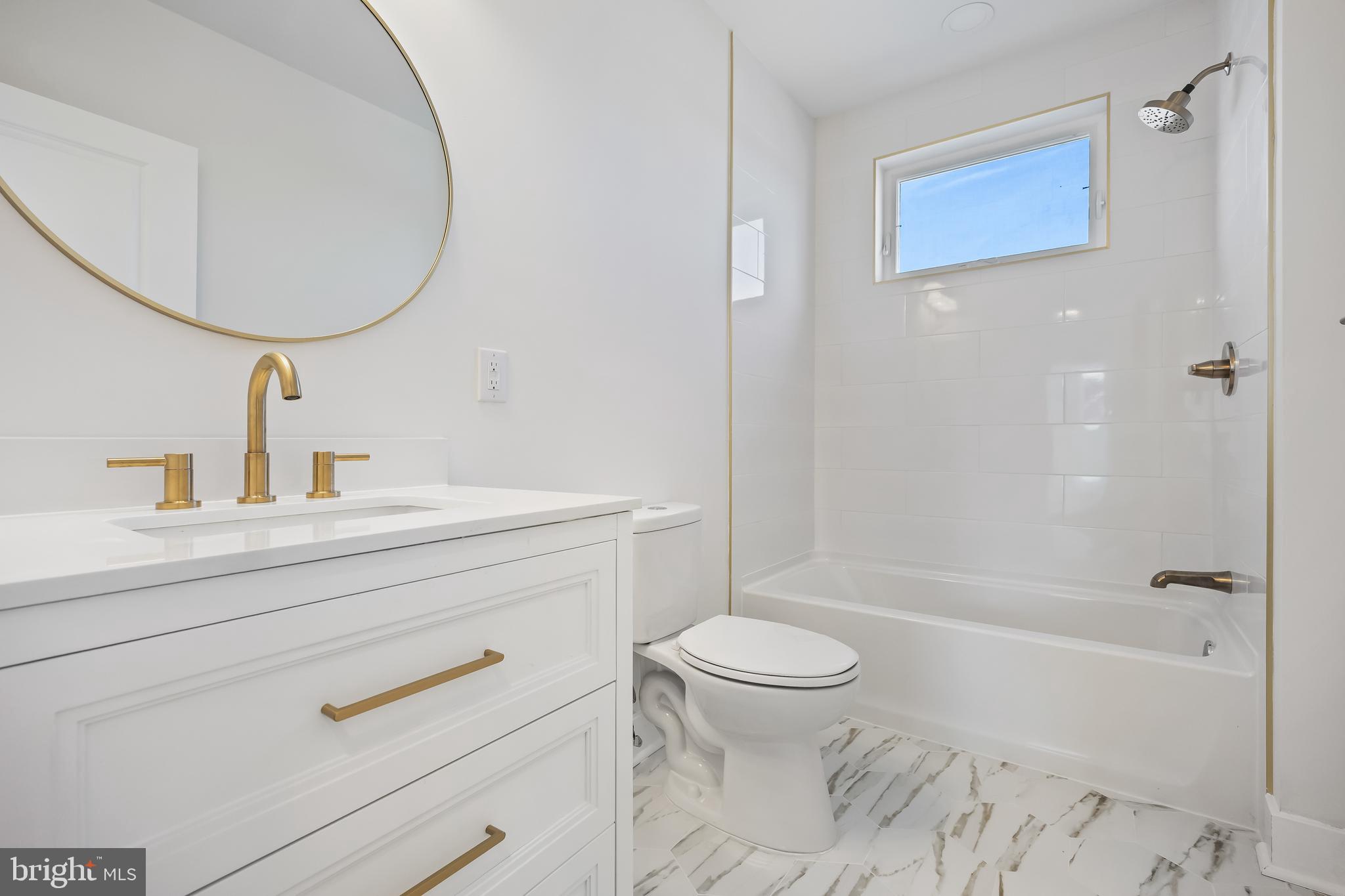 133 Lafayette Road Audubon, NJ 08106 - Photo 19 of 23 a bathroom with a sink a mirror a toilet and a bathtub