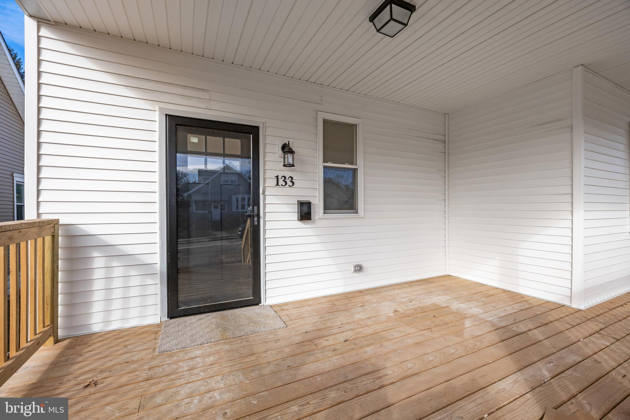 133 Lafayette Road Audubon, NJ 08106 - Photo 3 of 23 a view of a livingroom with wooden floor and a ceiling fan