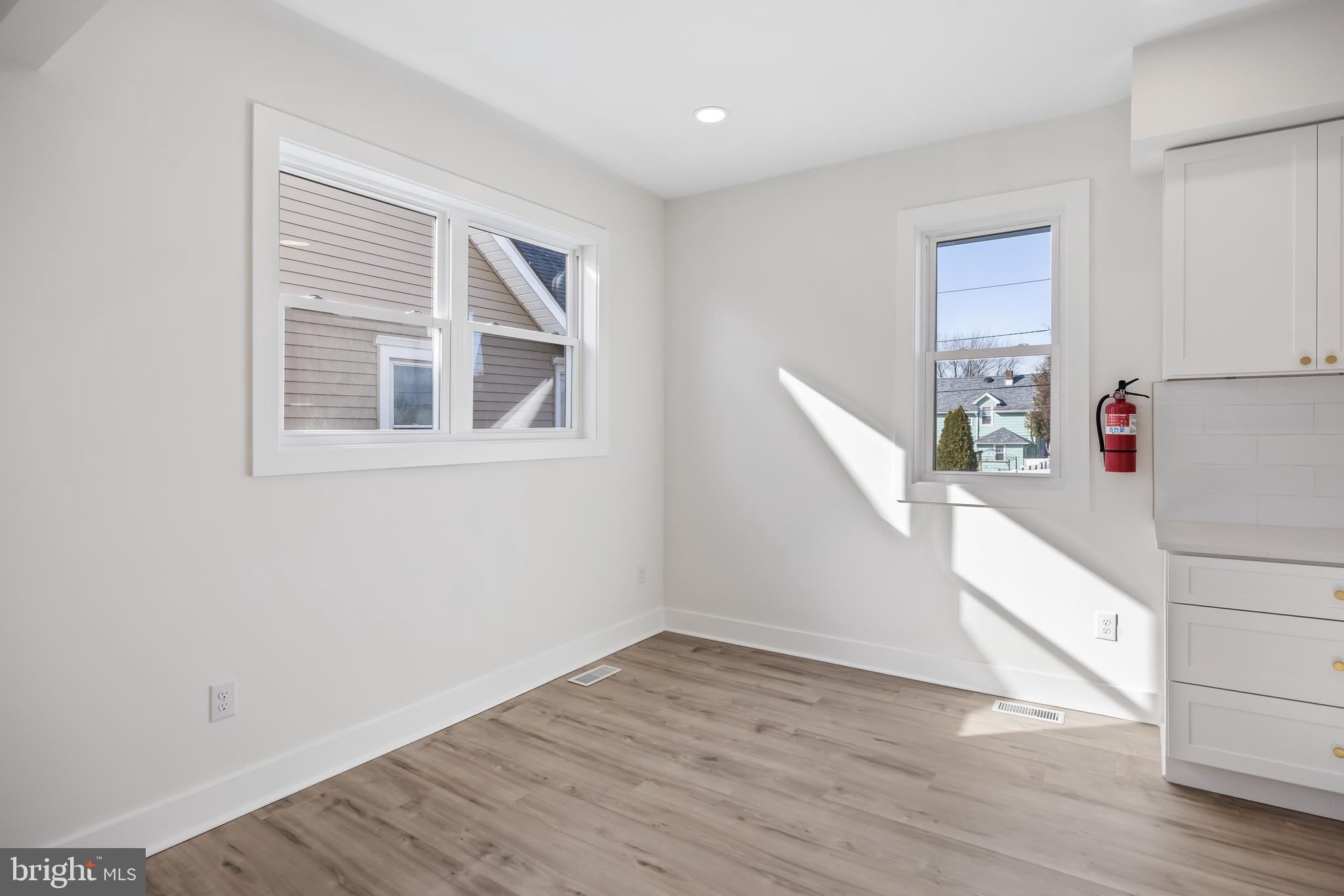 133 Lafayette Road Audubon, NJ 08106 - Photo 6 of 23 a view of empty room with wooden floor and fan