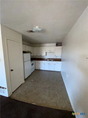 a view of a kitchen with a sink