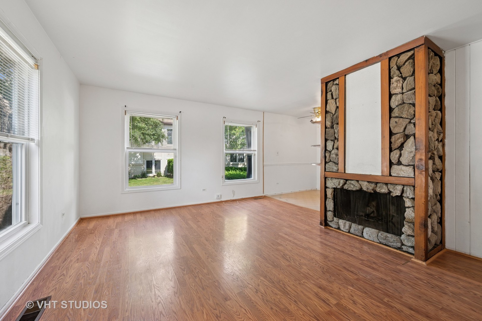 456 Inverrary Lane Deerfield, IL 60015 - Photo 2 of 17 wooden floor in an empty room with a window