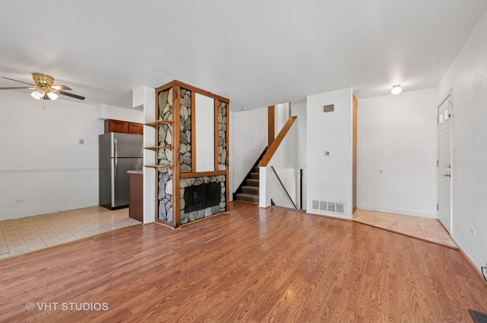 456 Inverrary Lane Deerfield, IL 60015 - Photo 3 of 17 a view of a hallway with wooden floor and staircase