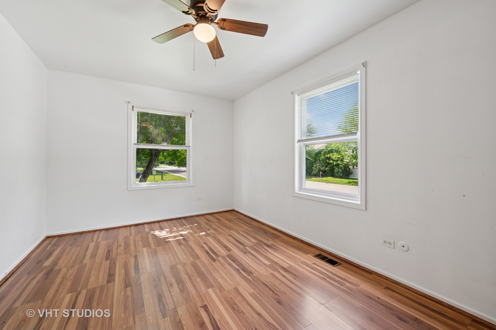 456 Inverrary Lane Deerfield, IL 60015 - Photo 6 of 17 wooden floor in an empty room with a window