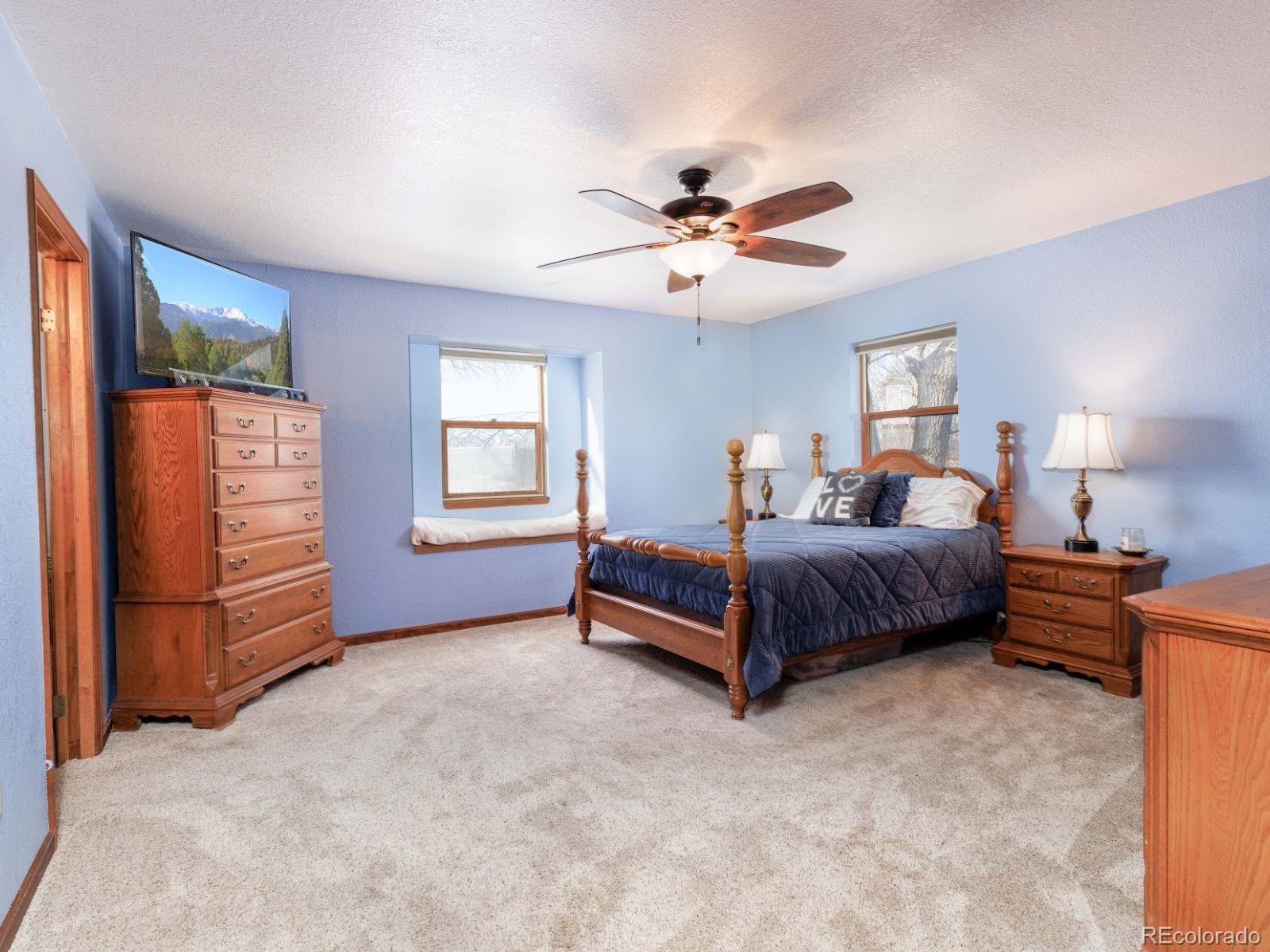 6115 Sengbeil Road Yoder, CO 80864 - Photo 16 of 43 a bedroom with a bed dresser and a window