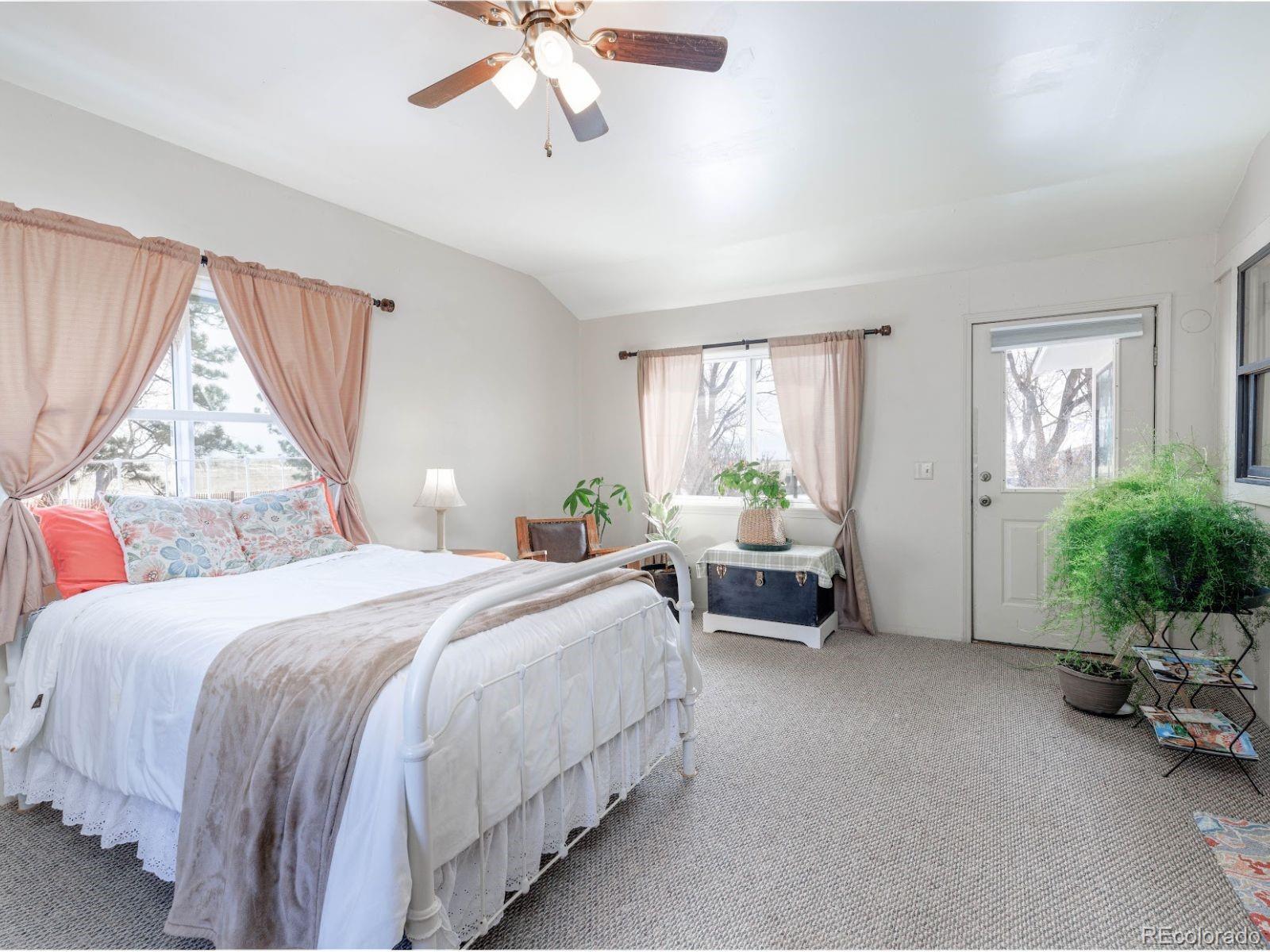 6115 Sengbeil Road Yoder, CO 80864 - Photo 23 of 43 a bedroom with a bed and a couch