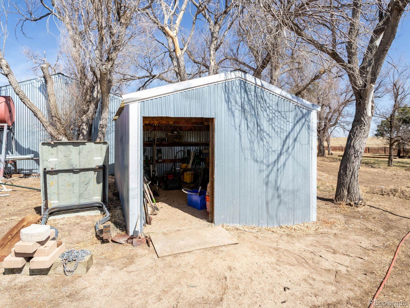 6115 Sengbeil Road Yoder, CO 80864 - Photo 32 of 43 a view of a house with a snow in the yard
