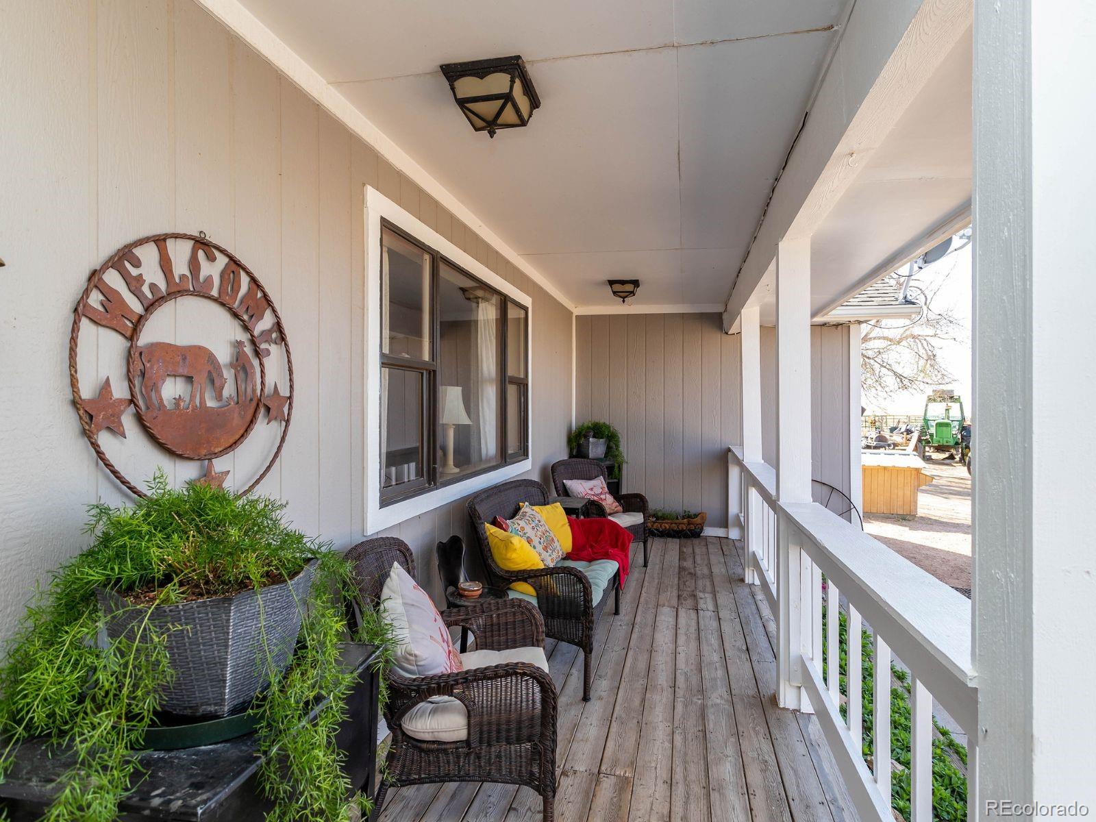 6115 Sengbeil Road Yoder, CO 80864 - Photo 6 of 43 a living room with furniture and a potted plant