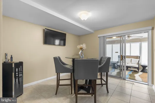 a dining room with furniture and window