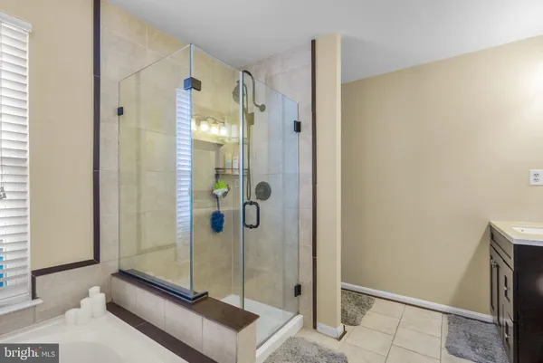 a bathroom with a shower and a sink