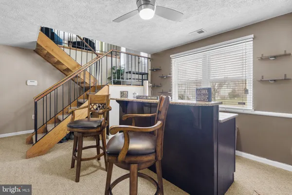 a dining room with furniture and entryway