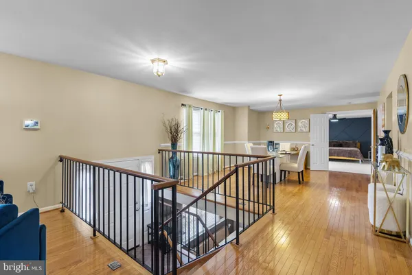a view of a room with wooden floor windows and a living room
