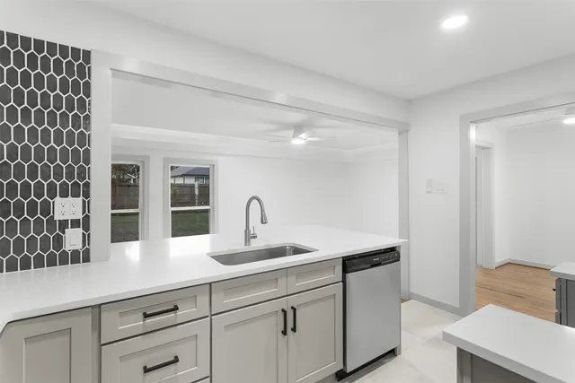 a close view of sink and cabinets
