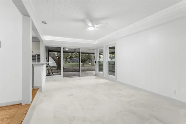 a view of an empty room with a fireplace