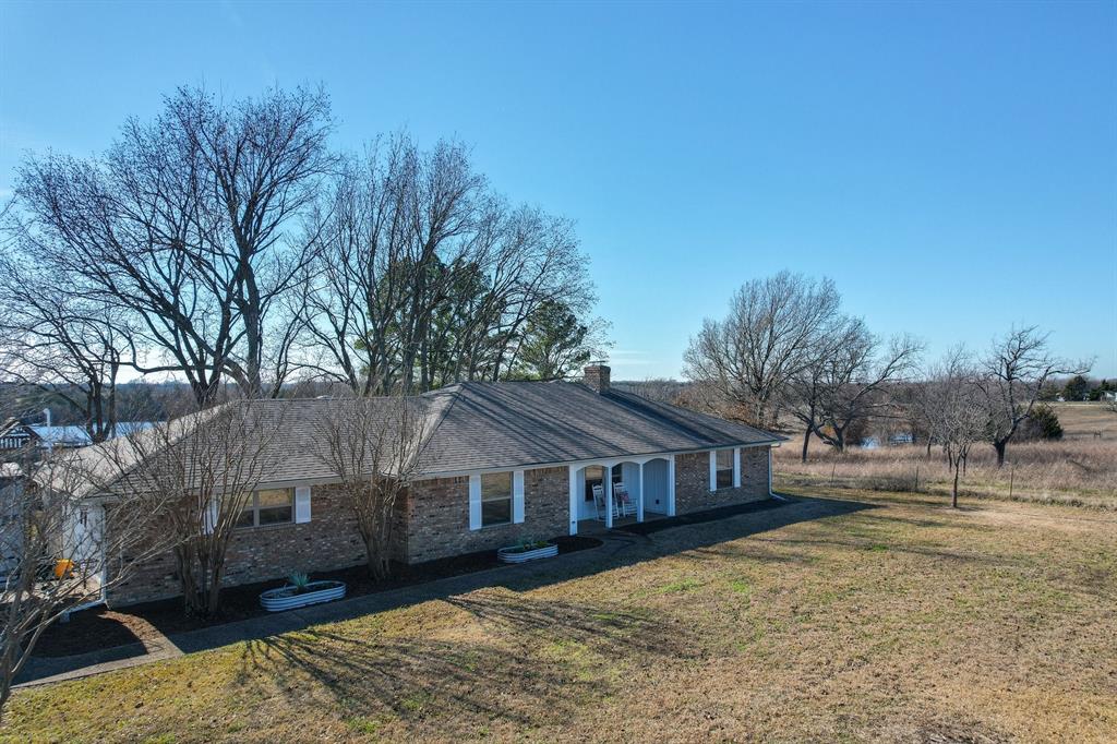 477 Fm 1553 Bonham, TX 75418 - Photo 3 of 10 a front view of a house with a yard
