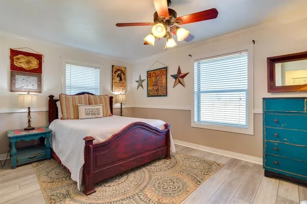 a bedroom with a large bed and a window