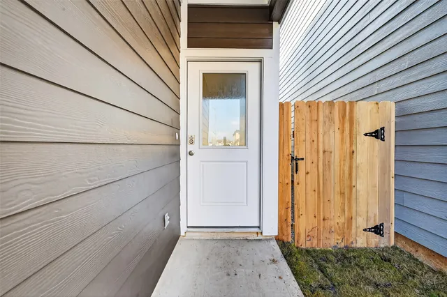 a view of a hallway with stairs