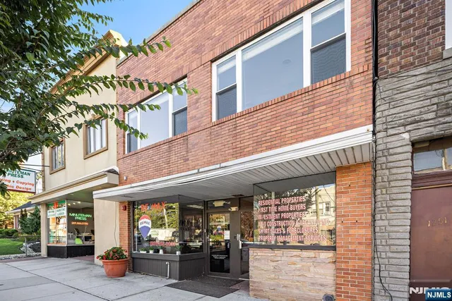 a view of a building with sitting area
