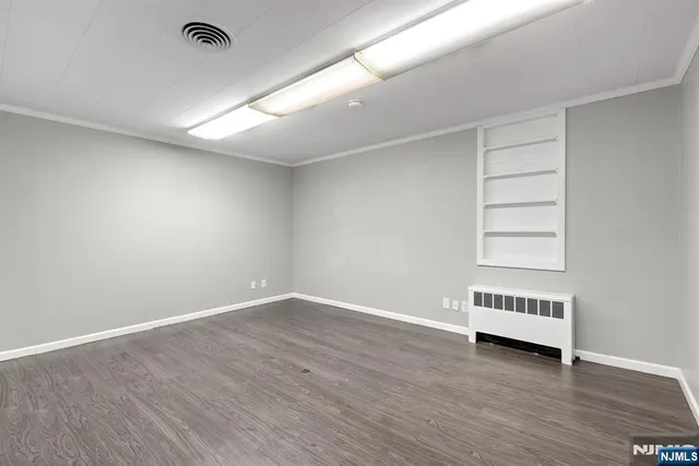 an empty room with wooden floors
