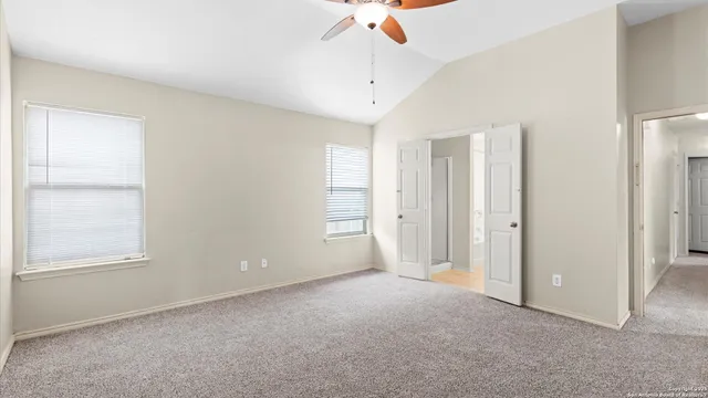a spacious bathroom with a double vanity sink a mirror and a bathtub