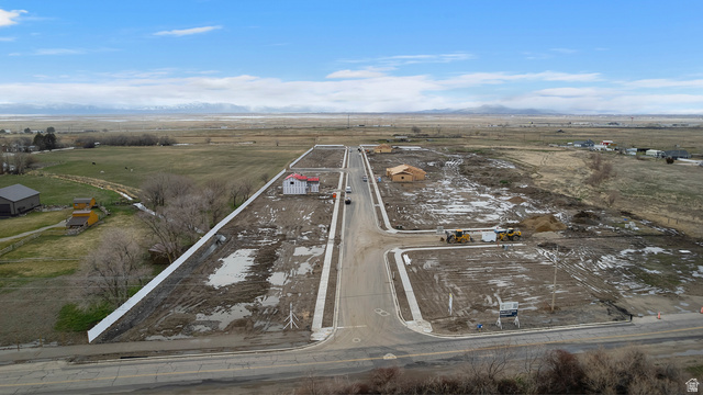 1417 West 2350th South, Unit 14 Perry, UT 84302 - Photo 17 of 19 Expansive development site featuring multiple cleared lots with new concrete curbing and sidewalks