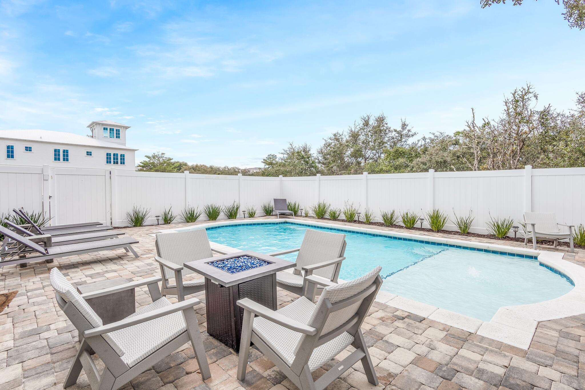 101 A St Inlet Beach Inlet Beach, FL 32461 - Photo 13 of 49 a view of a swimming pool with lounge chairs