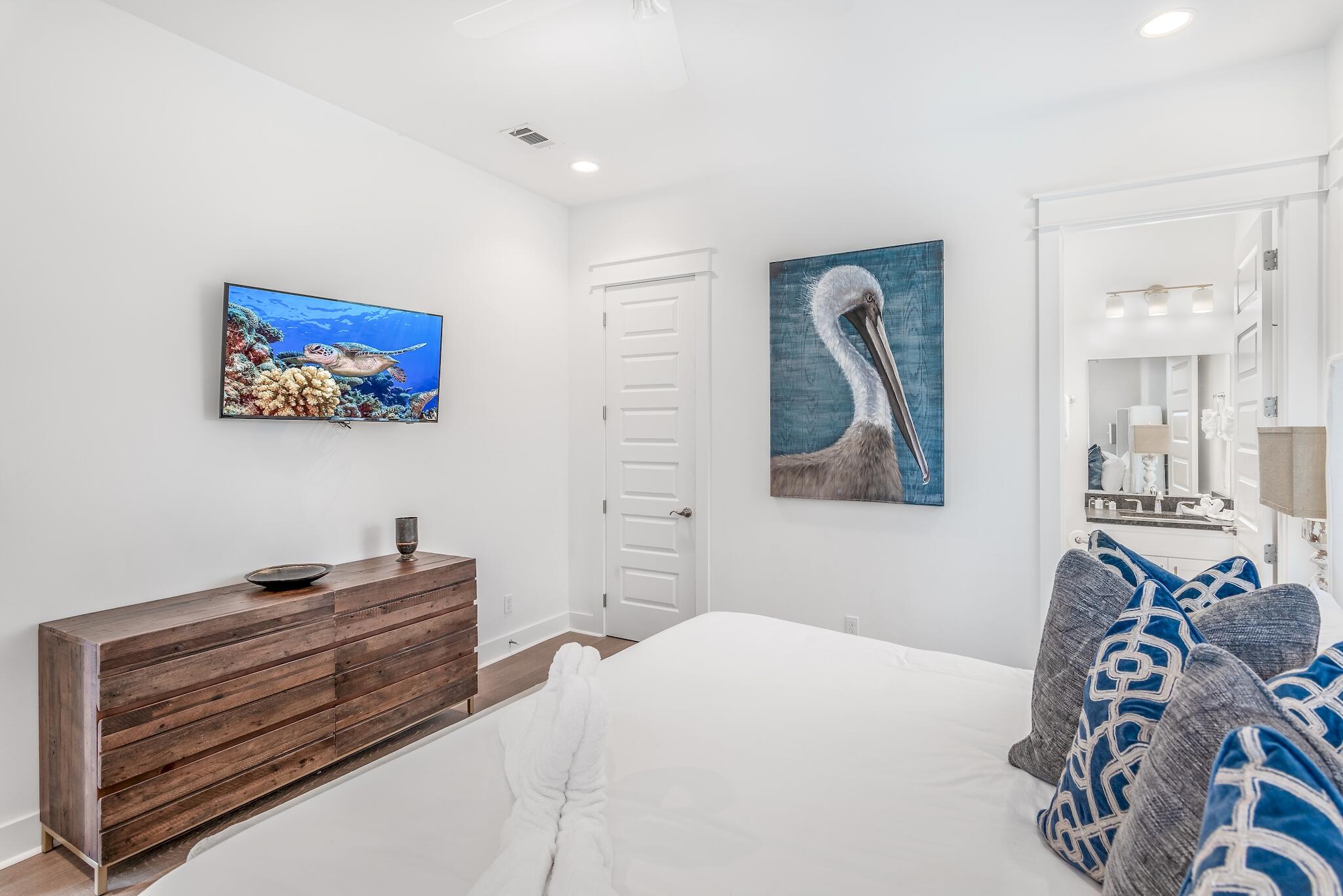 101 A St Inlet Beach Inlet Beach, FL 32461 - Photo 18 of 49 a bedroom with a bed and a painting on the wall