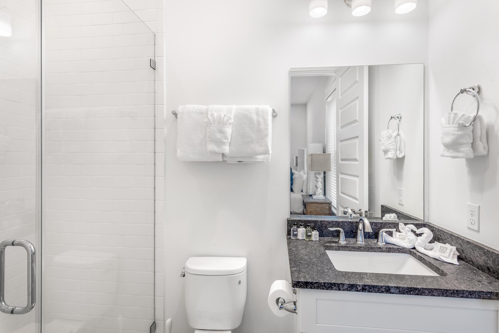 101 A St Inlet Beach Inlet Beach, FL 32461 - Photo 20 of 49 a bathroom with a granite countertop sink a toilet and a mirror