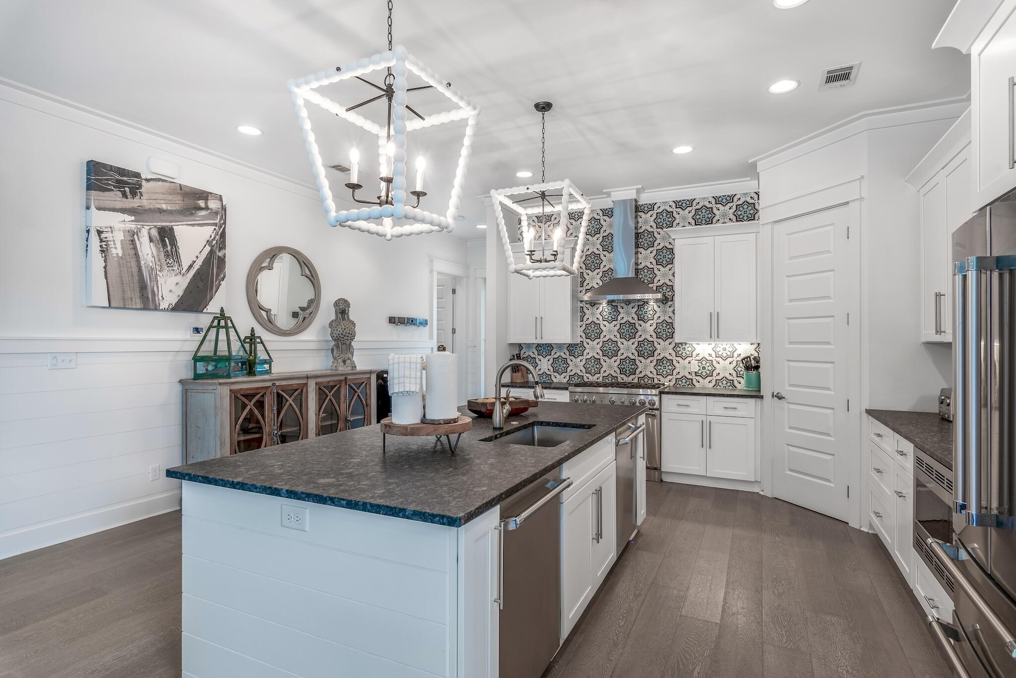 101 A St Inlet Beach Inlet Beach, FL 32461 - Photo 2 of 49 a kitchen with stainless steel appliances granite countertop a sink stove and refrigerator