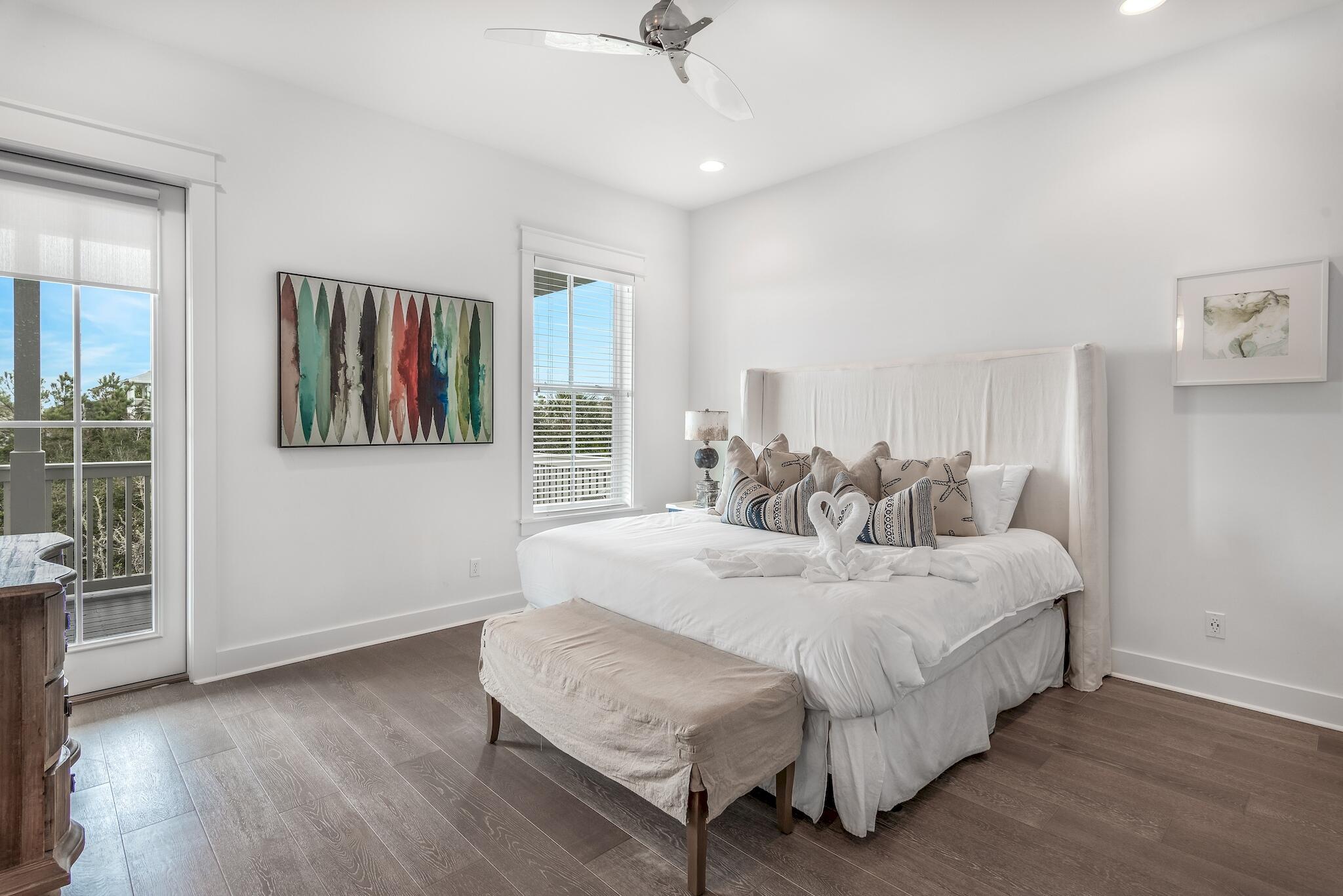 101 A St Inlet Beach Inlet Beach, FL 32461 - Photo 21 of 49 a spacious bedroom with a bed and a table in it