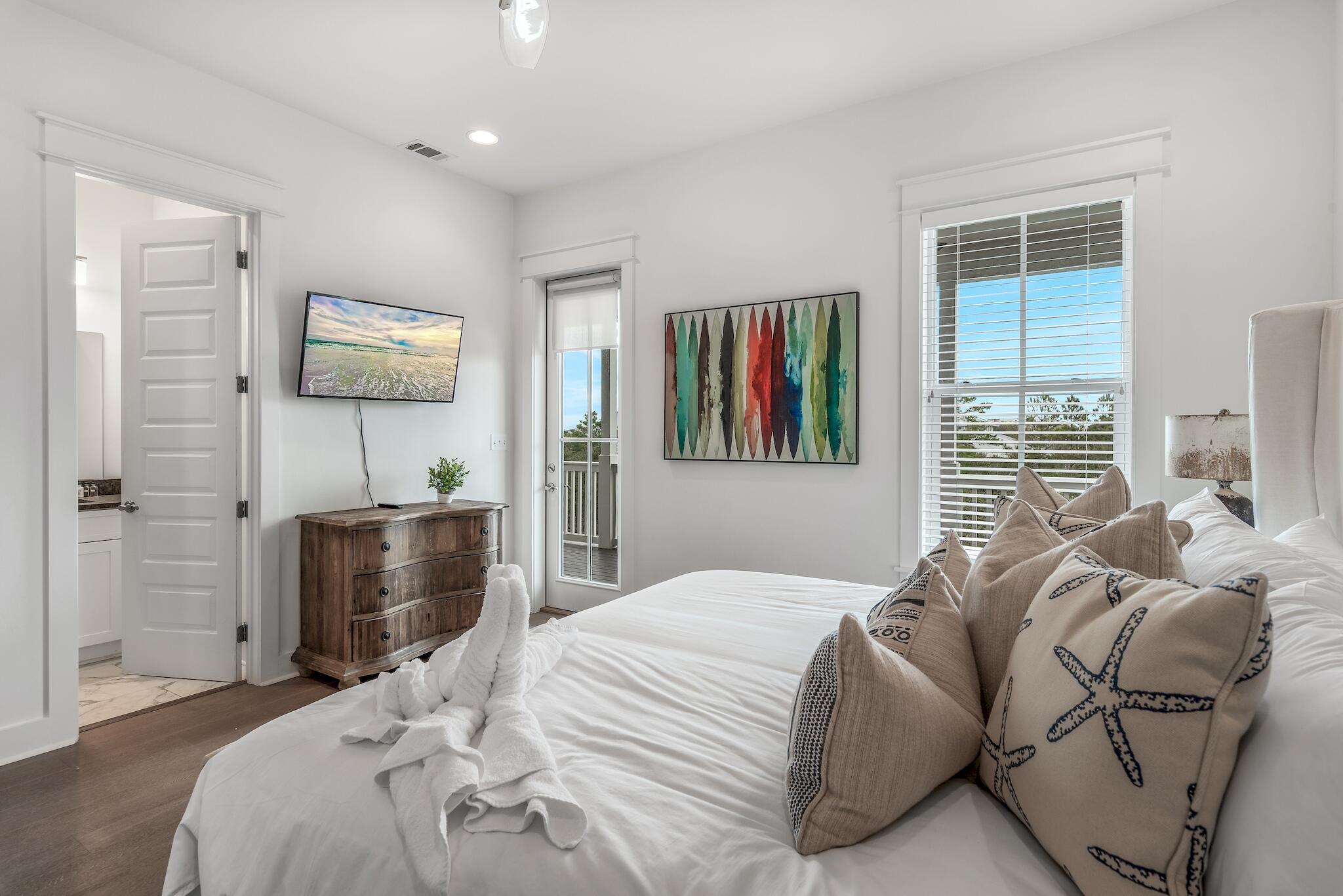 101 A St Inlet Beach Inlet Beach, FL 32461 - Photo 22 of 49 a bedroom with a bed and a flat screen tv