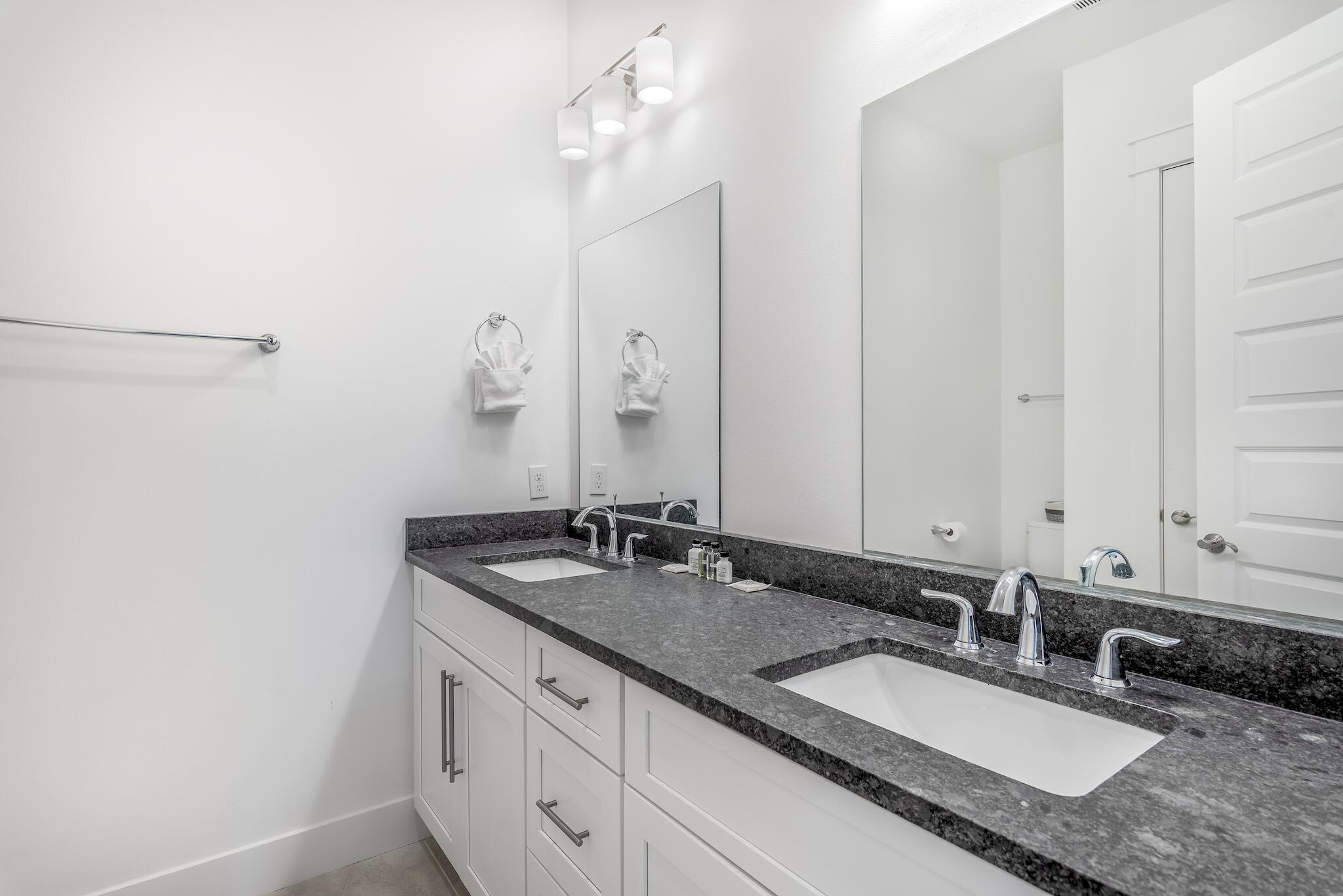 101 A St Inlet Beach Inlet Beach, FL 32461 - Photo 27 of 49 a bathroom with a granite countertop sink and a mirror