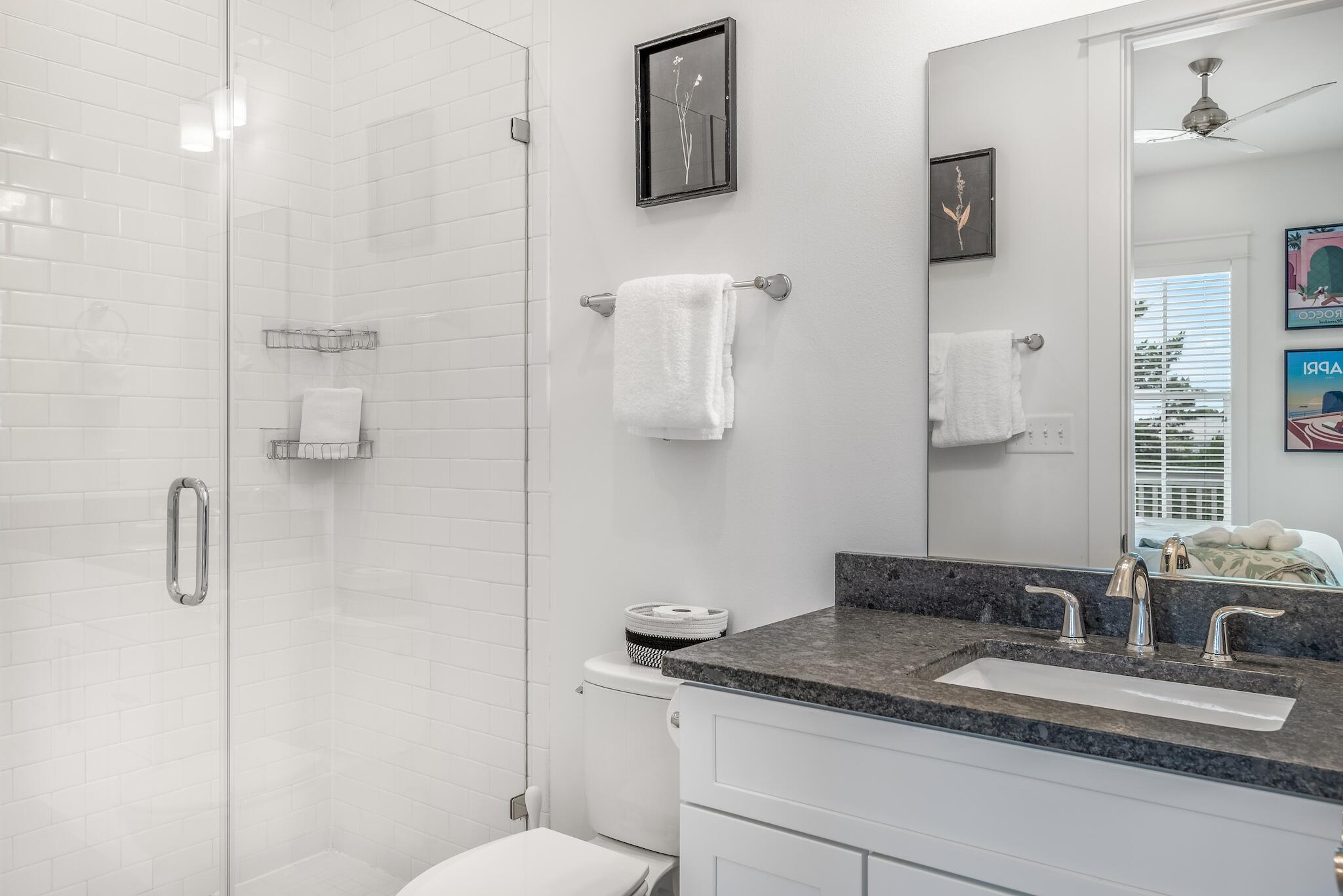 101 A St Inlet Beach Inlet Beach, FL 32461 - Photo 30 of 49 a bathroom with a granite countertop sink a toilet and shower