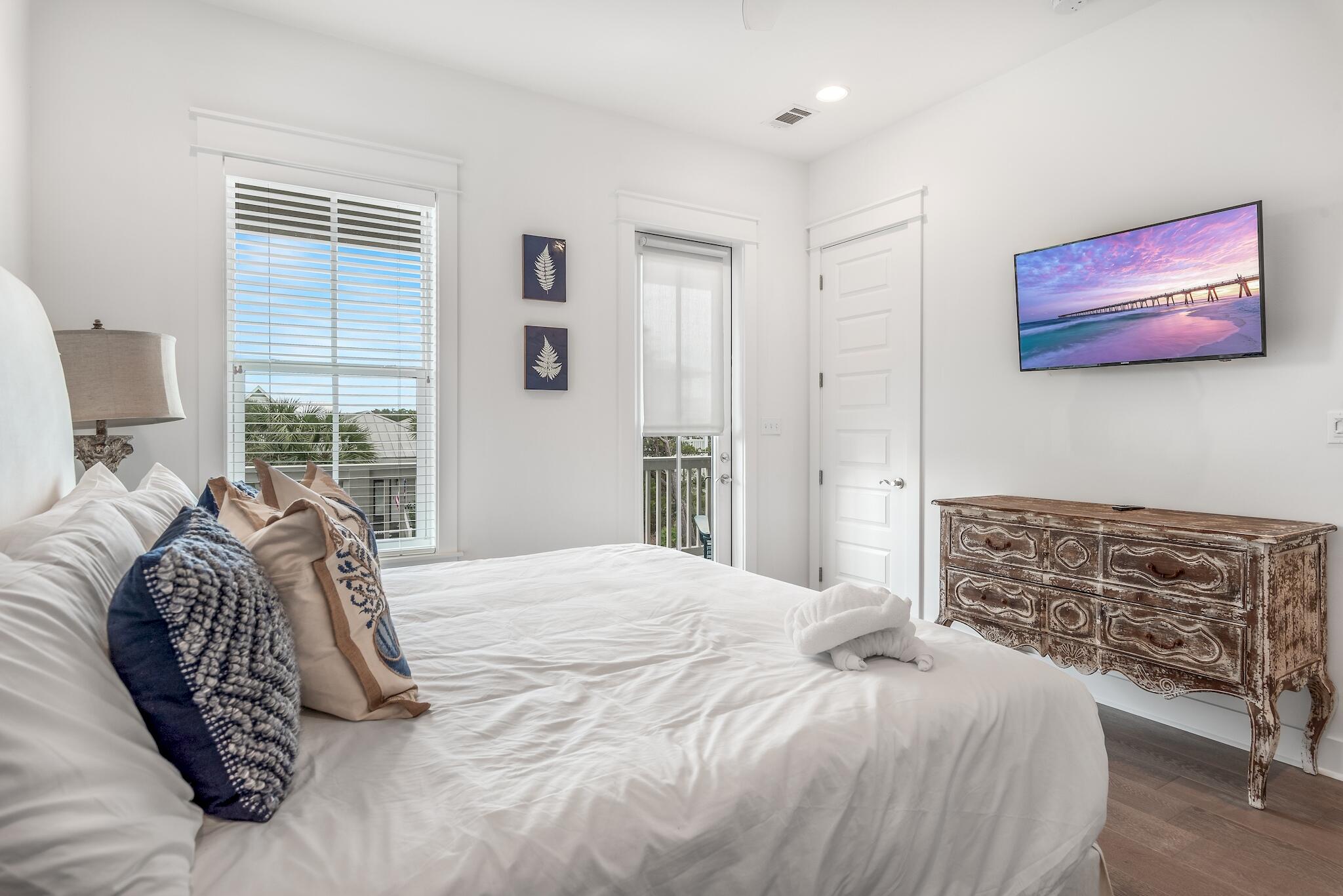 101 A St Inlet Beach Inlet Beach, FL 32461 - Photo 32 of 49 a bedroom with a bed and a window