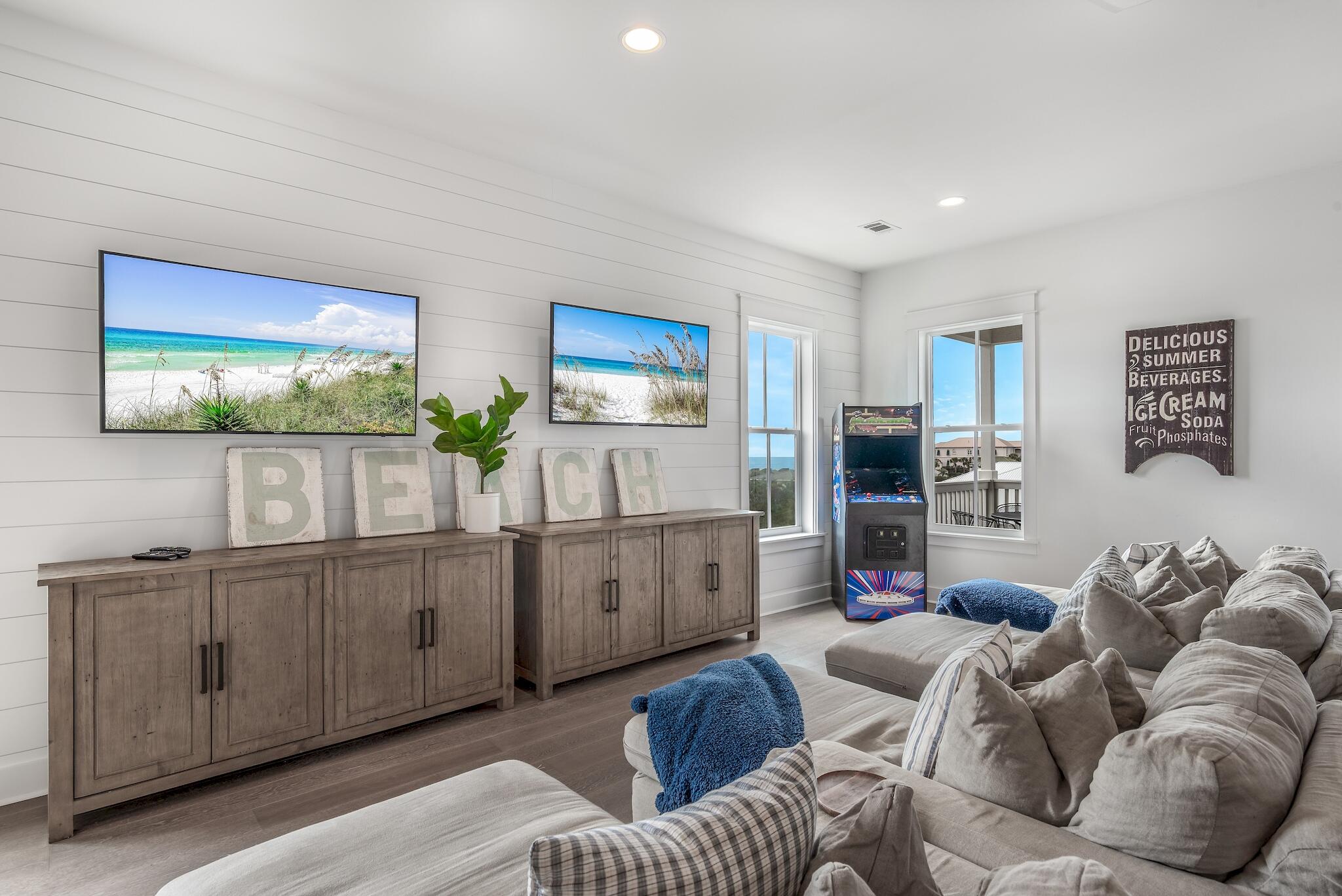 101 A St Inlet Beach Inlet Beach, FL 32461 - Photo 39 of 49 a kitchen with stainless steel appliances granite countertop a couch and a wooden floors
