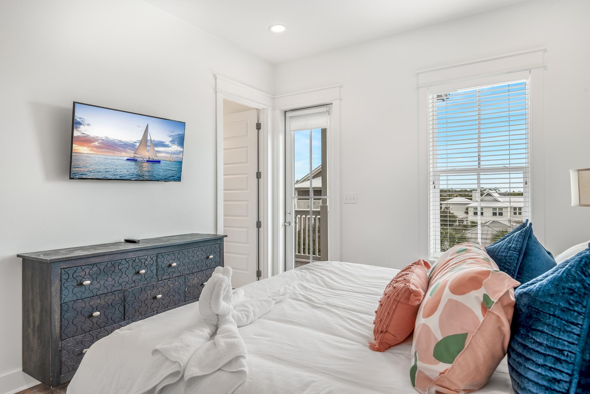 101 A St Inlet Beach Inlet Beach, FL 32461 - Photo 46 of 49 a bedroom with a bed and dresser with mirror