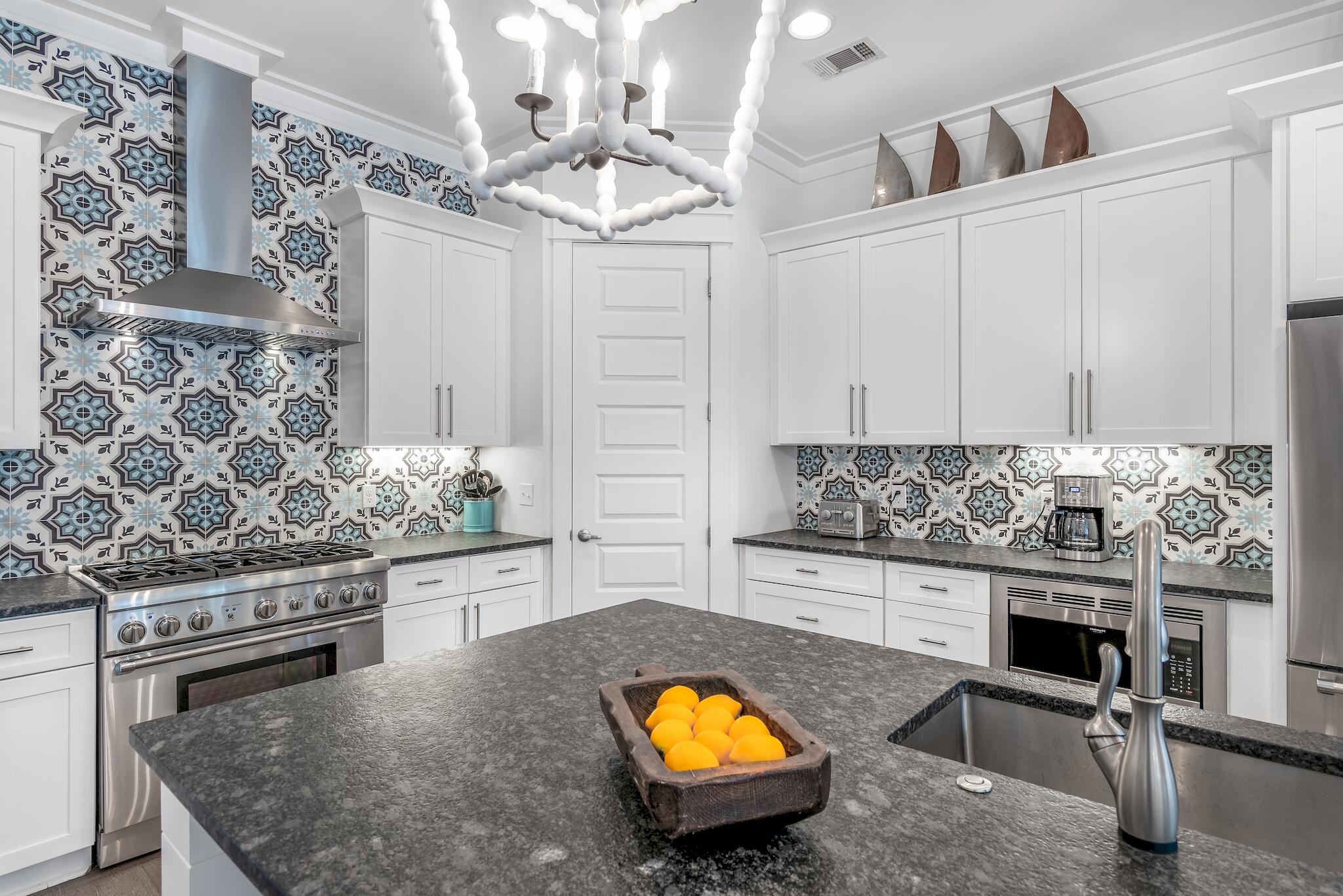 101 A St Inlet Beach Inlet Beach, FL 32461 - Photo 5 of 49 a kitchen with stainless steel appliances a stove a sink and a refrigerator