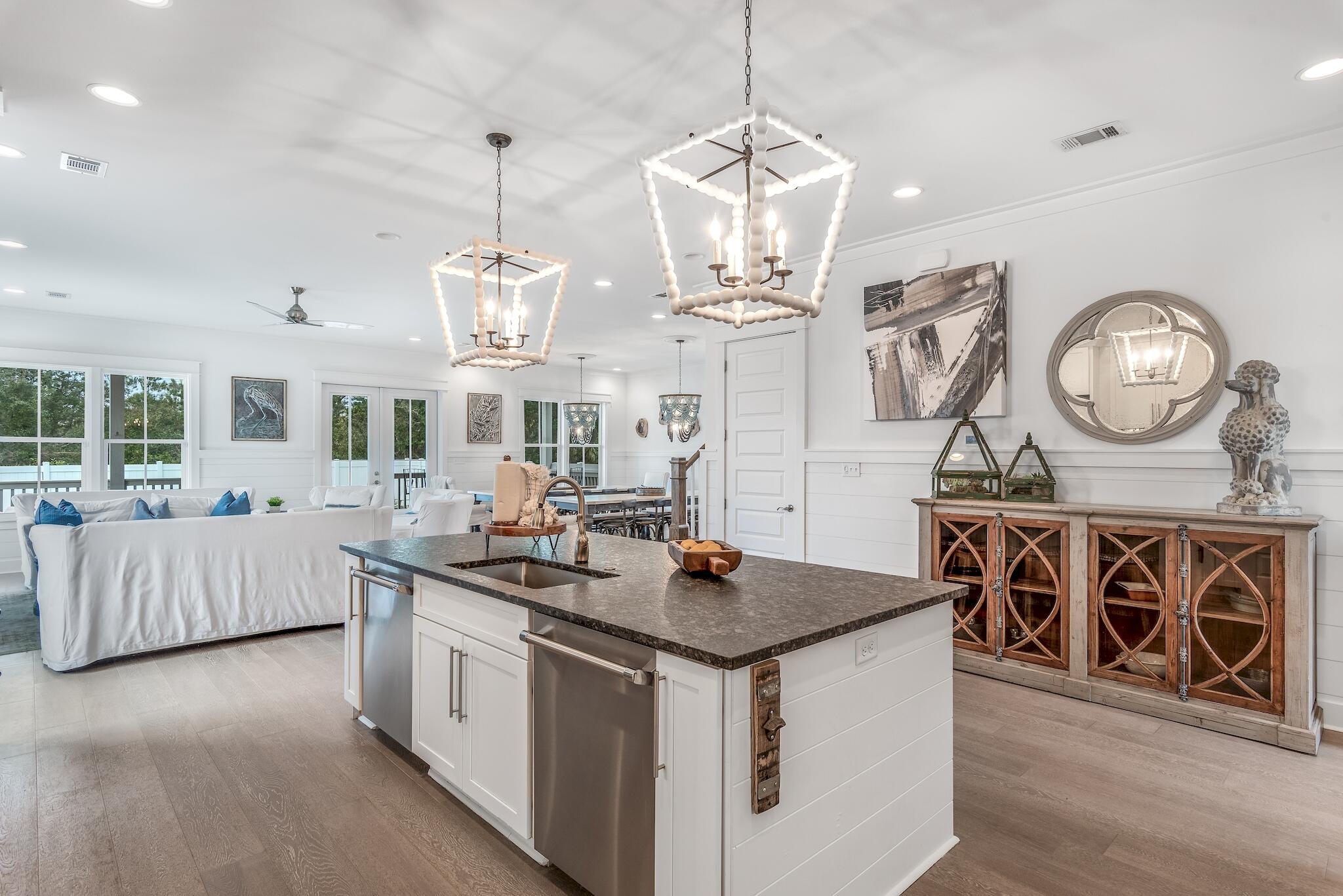 101 A St Inlet Beach Inlet Beach, FL 32461 - Photo 6 of 49 a kitchen with stainless steel appliances granite countertop a stove and a wooden floors