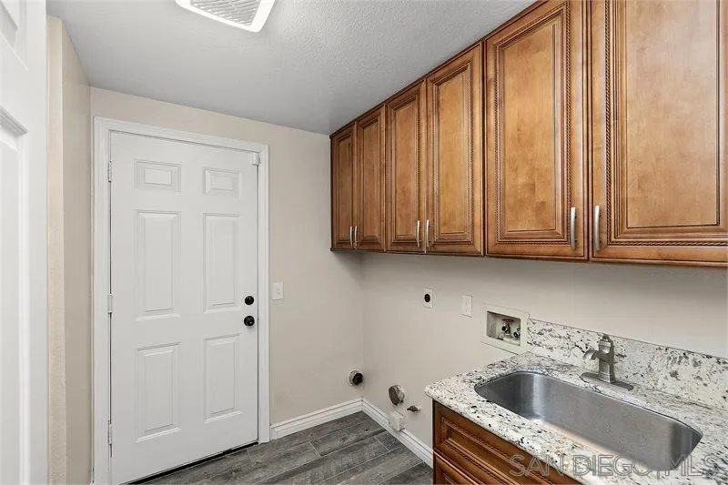 44113 Northgate Avenue Temecula, CA 92592 - Photo 17 of 30 a kitchen with a sink cabinets and utility