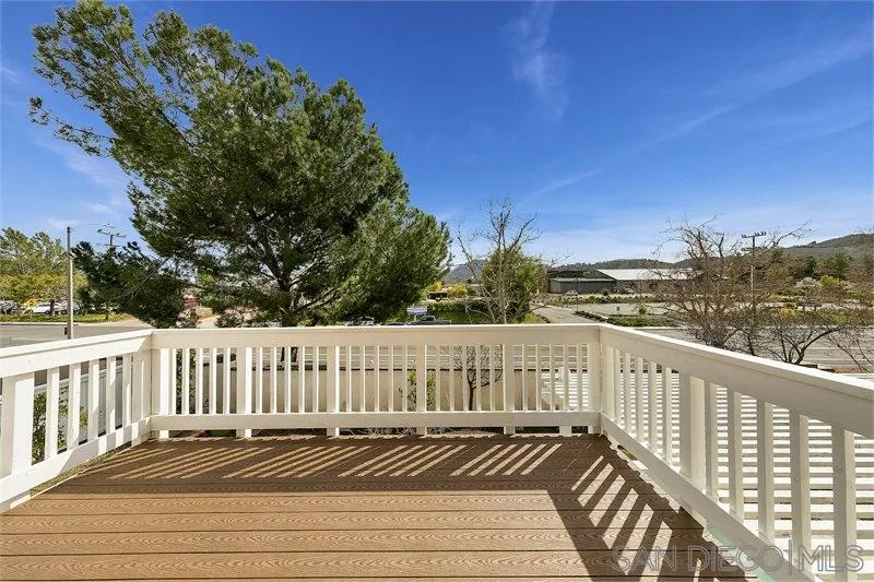 44113 Northgate Avenue Temecula, CA 92592 - Photo 25 of 30 a view of a balcony with wooden fence and floor