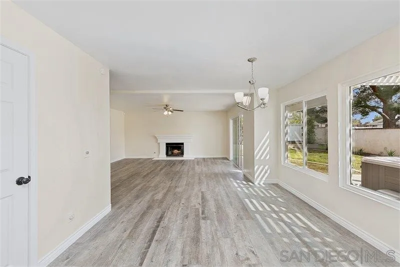 44113 Northgate Avenue Temecula, CA 92592 - Photo 8 of 30 a view of empty room with wooden floor and fireplace