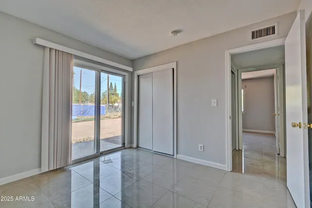 a view of an empty room and window