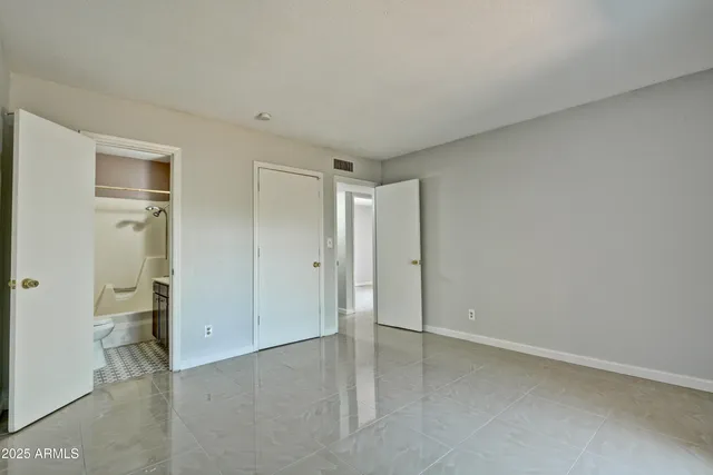 an empty room with a bathroom