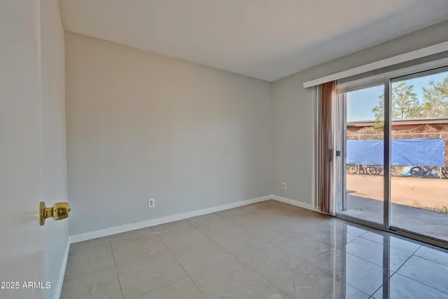 a view of an empty room and window