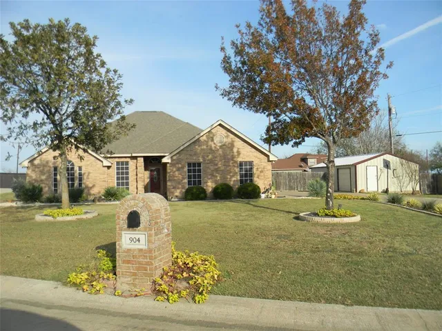 a view of a swimming pool with a yard