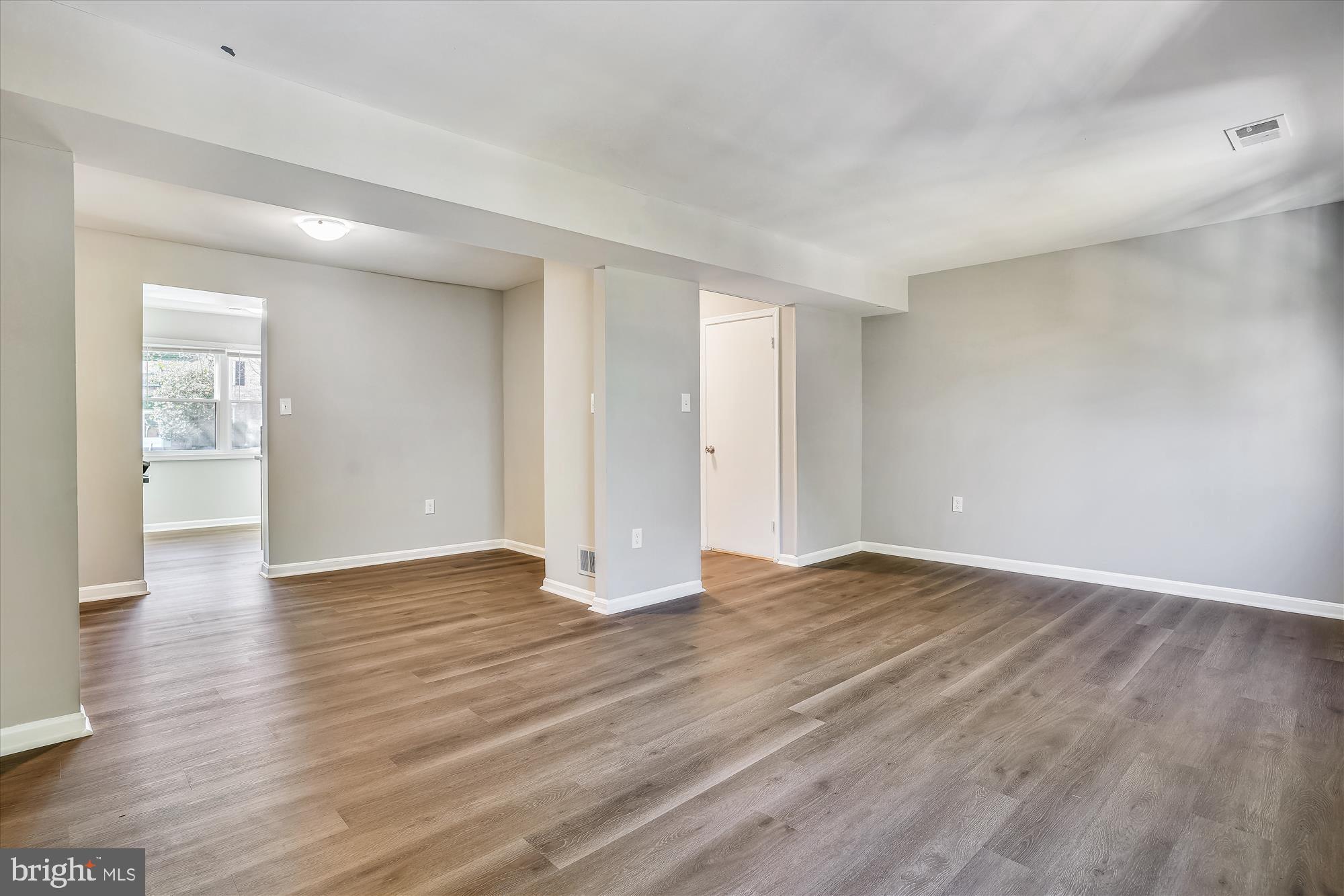 9202 Sprucewood Road Burke, VA 22015 - Photo 12 of 21 a view of an empty room with wooden floor